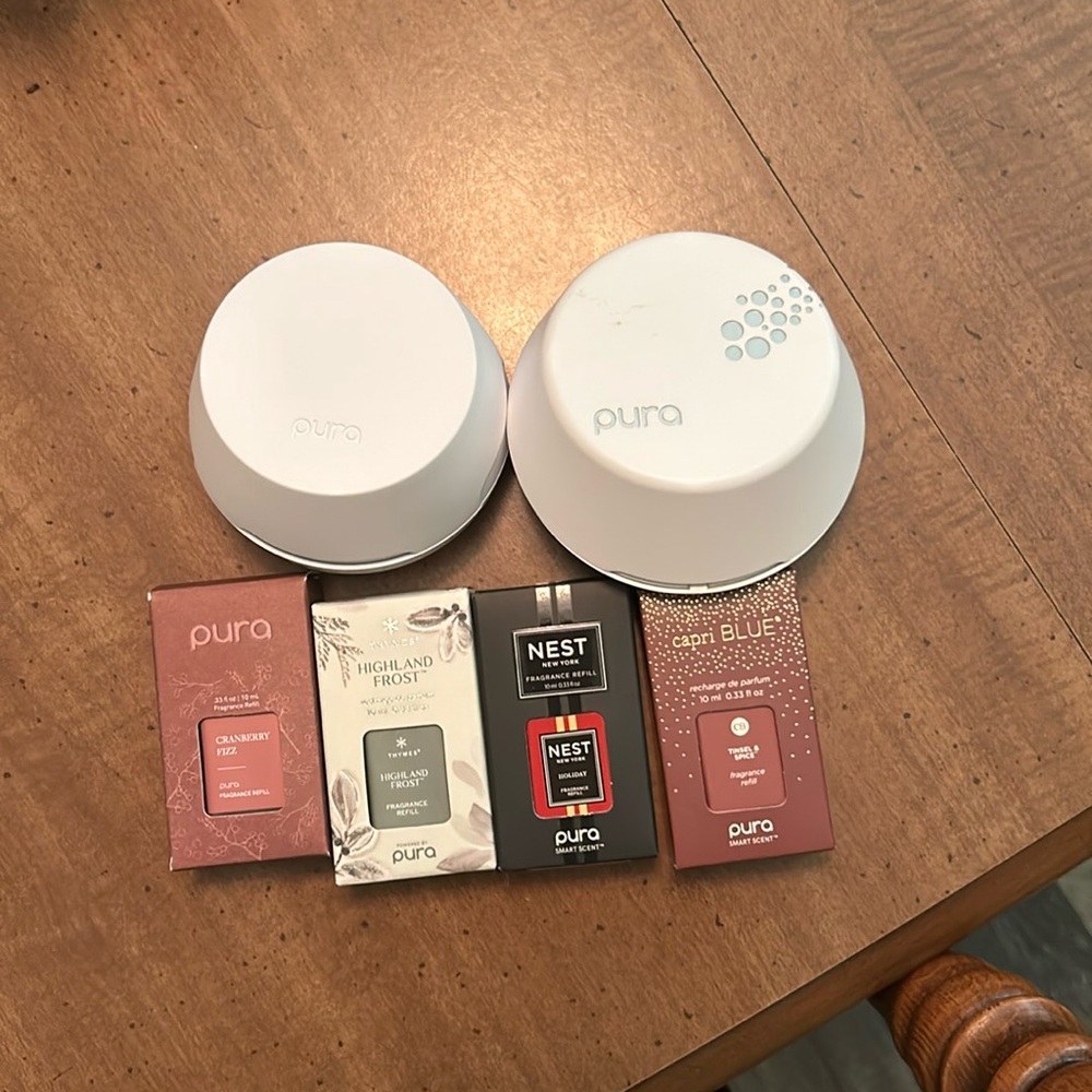 2 Pura diffusers with extra scents